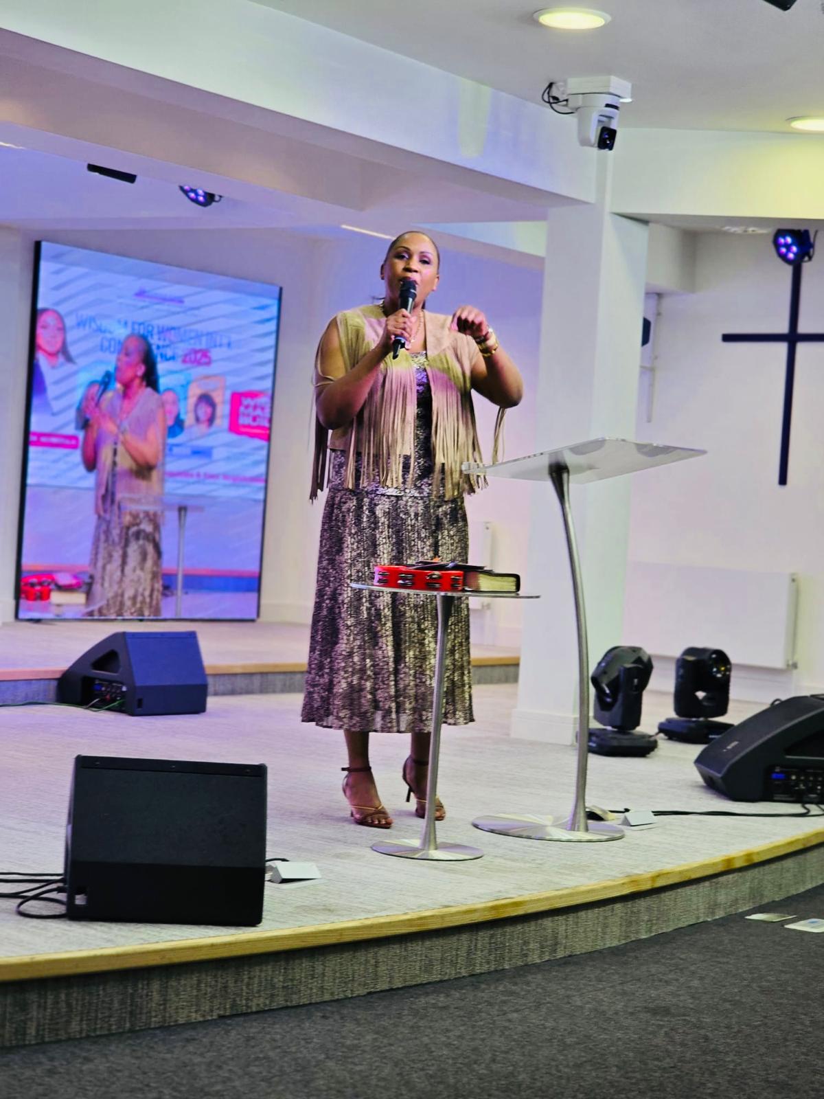 Rev. Eve at podium